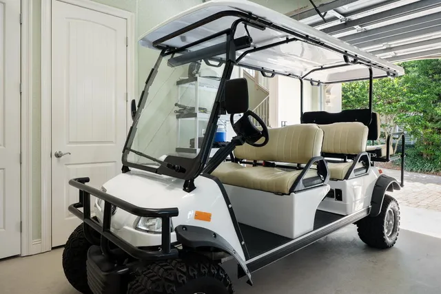 a dining room with furniture and a large window