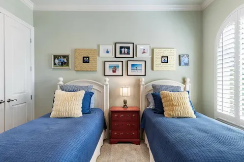 a living room filled with furniture and a large window