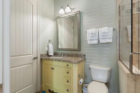 a sign that is sitting in front of flowers