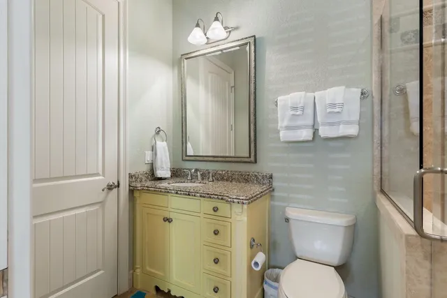 a sign that is sitting in front of flowers