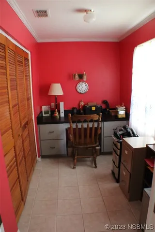 a room with furniture and a lamp