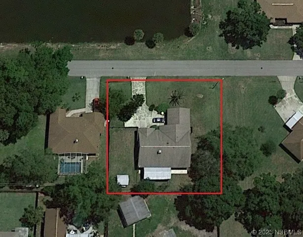 an aerial view of a house with outdoor space