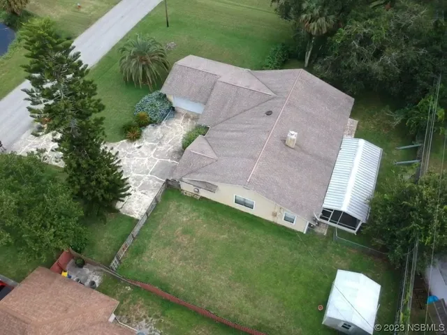 an aerial view of a house with a garden