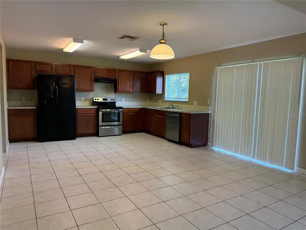 a large kitchen with cabinets