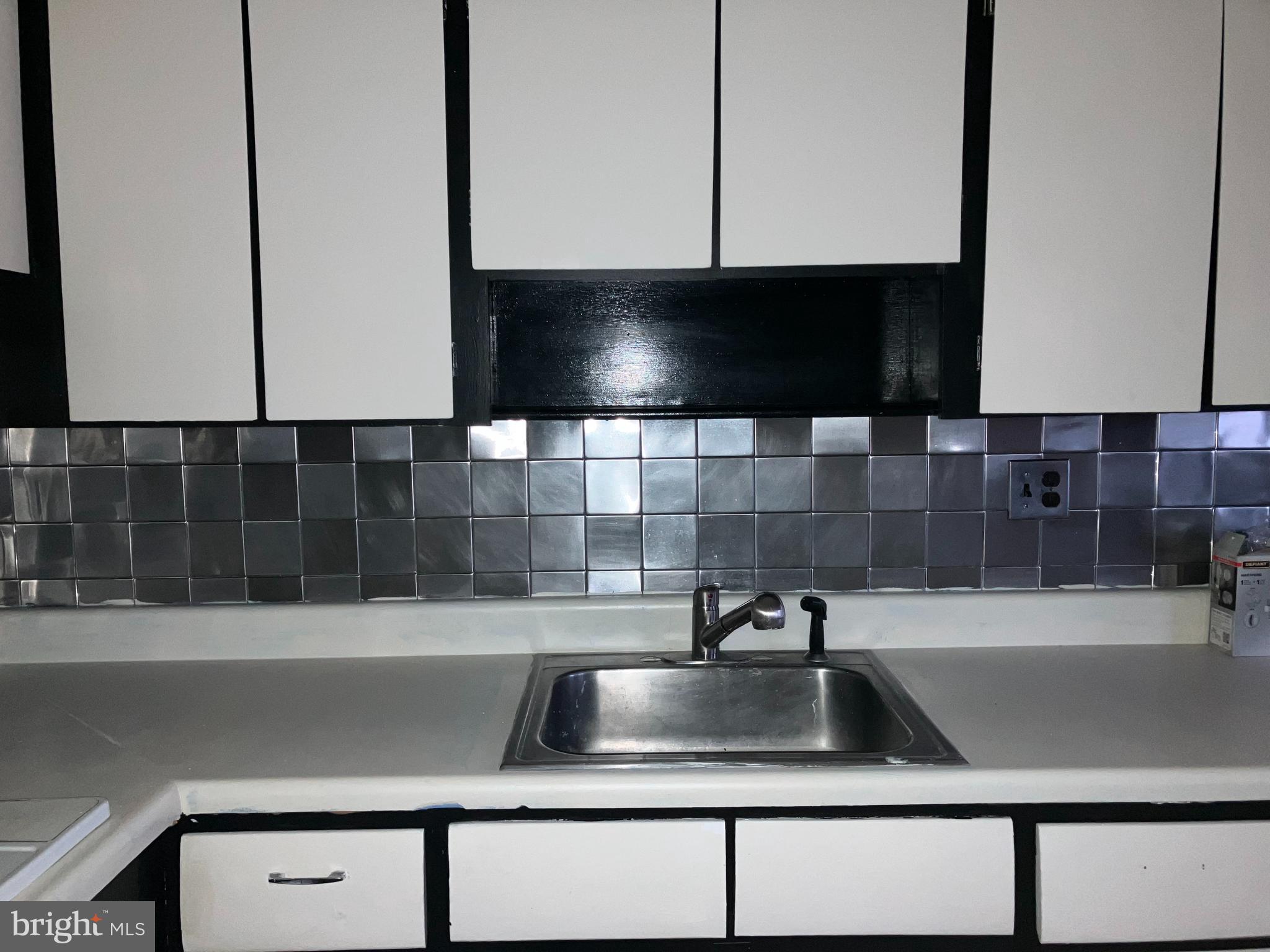 10031 Bridle Road Philadelphia, PA 19116 - Photo 18 of 32 a kitchen with a sink and a microwave