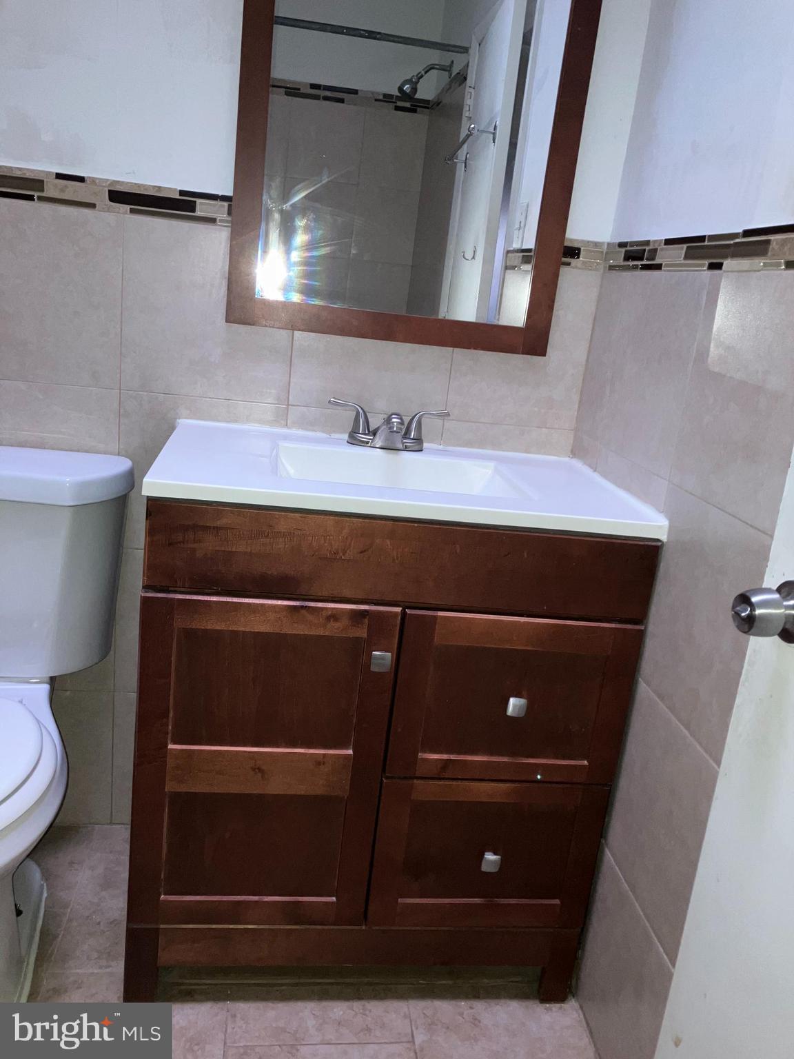 10031 Bridle Road Philadelphia, PA 19116 - Photo 21 of 32 a bathroom with a sink and a toilet