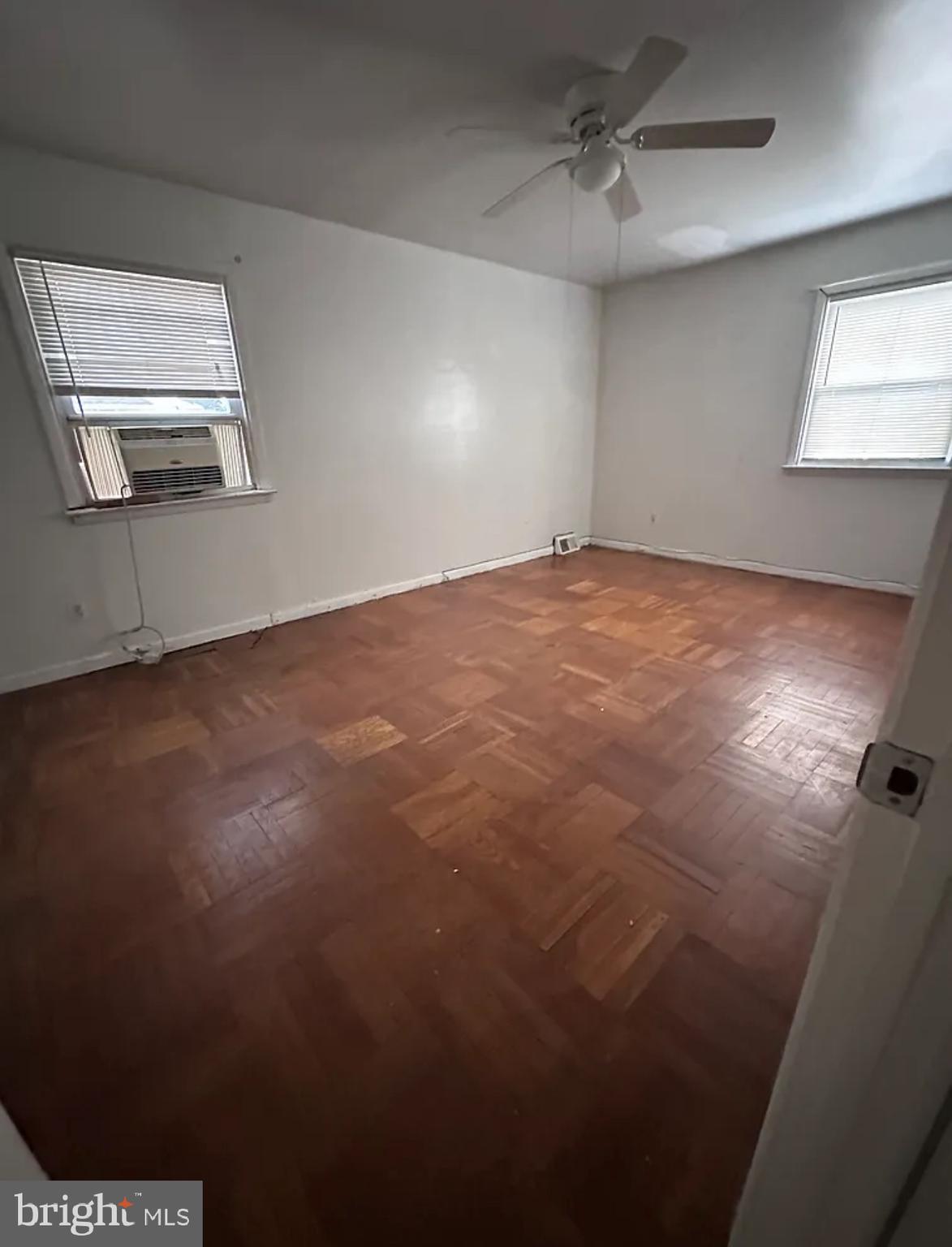 10031 Bridle Road Philadelphia, PA 19116 - Photo 27 of 32 en empty room with windows and ceiling fan
