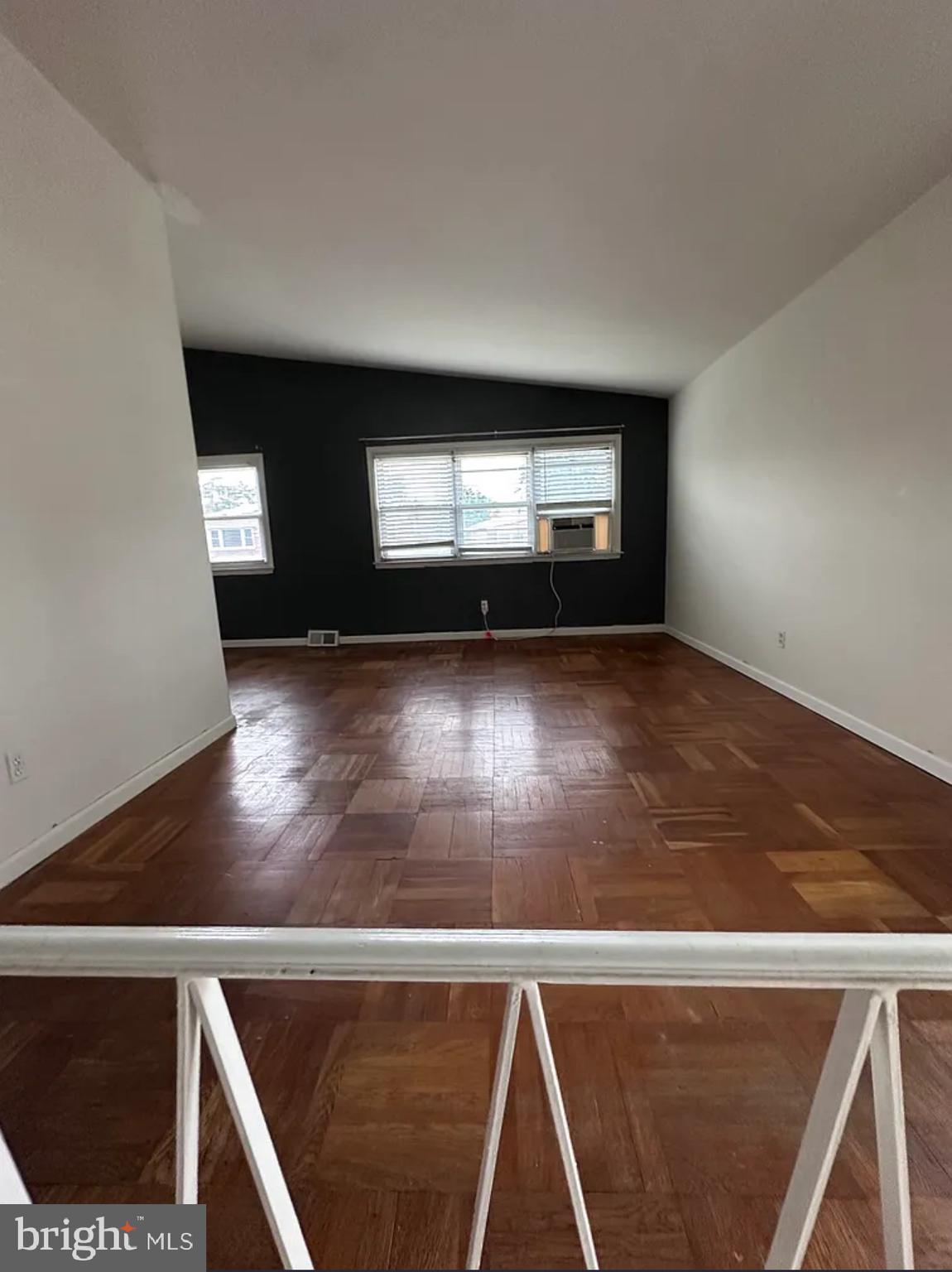 10031 Bridle Road Philadelphia, PA 19116 - Photo 5 of 32 a view of an empty room with wooden floor and a window