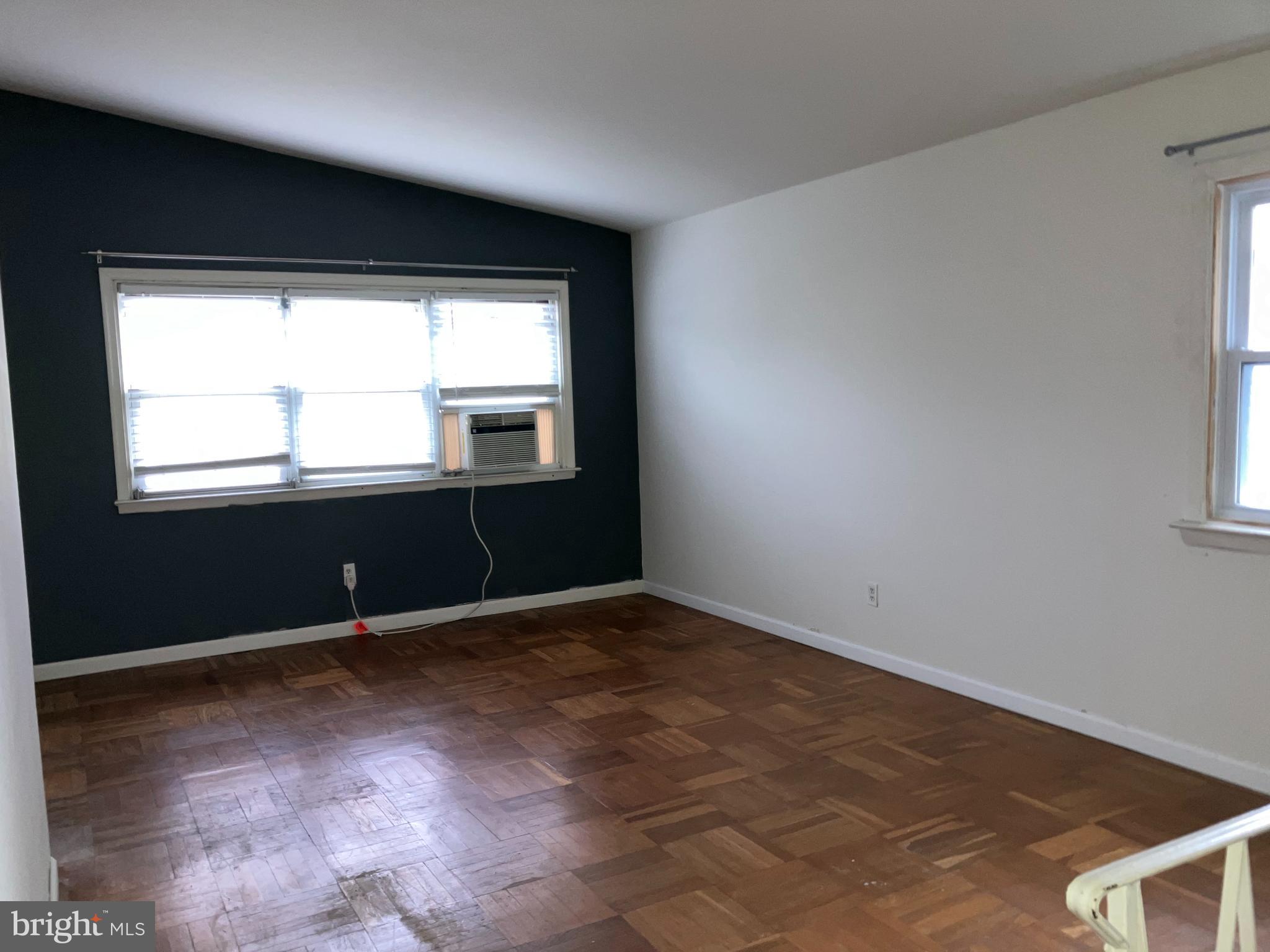 10031 Bridle Road Philadelphia, PA 19116 - Photo 8 of 32 an empty room with wooden floor and windows