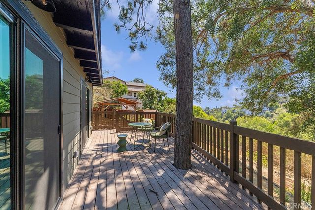 a view of a balcony with wooden floor