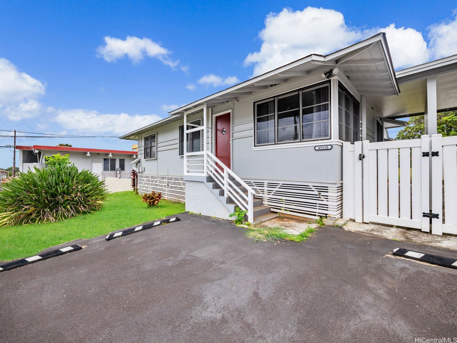 45-510 Pahia Road Kaneohe, HI 96744 - Photo 1 of 24 a view of a house with a patio and a yard