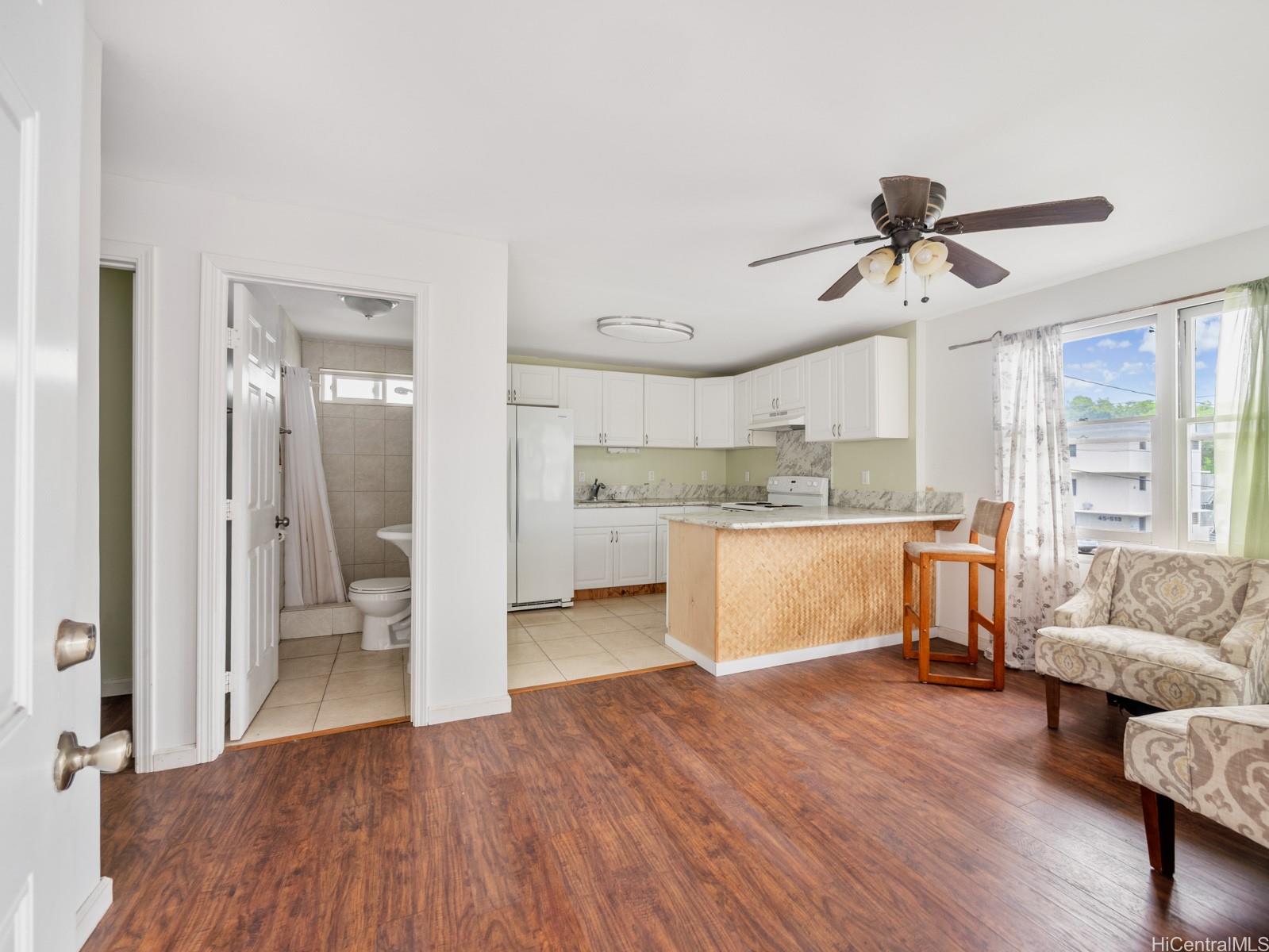 45-510 Pahia Road Kaneohe, HI 96744 - Photo 13 of 24 a view of kitchen with cabinets and wooden floor