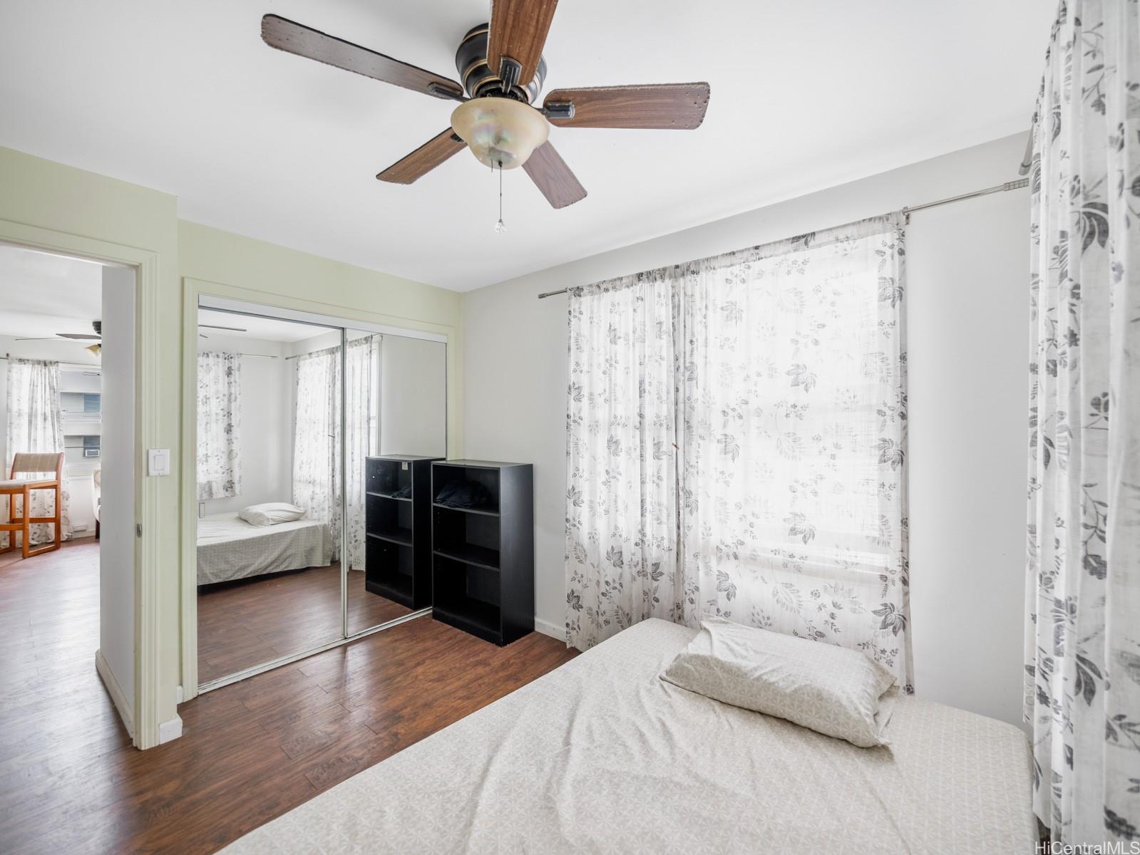 45-510 Pahia Road Kaneohe, HI 96744 - Photo 16 of 24 a bedroom with a bed and a chandelier