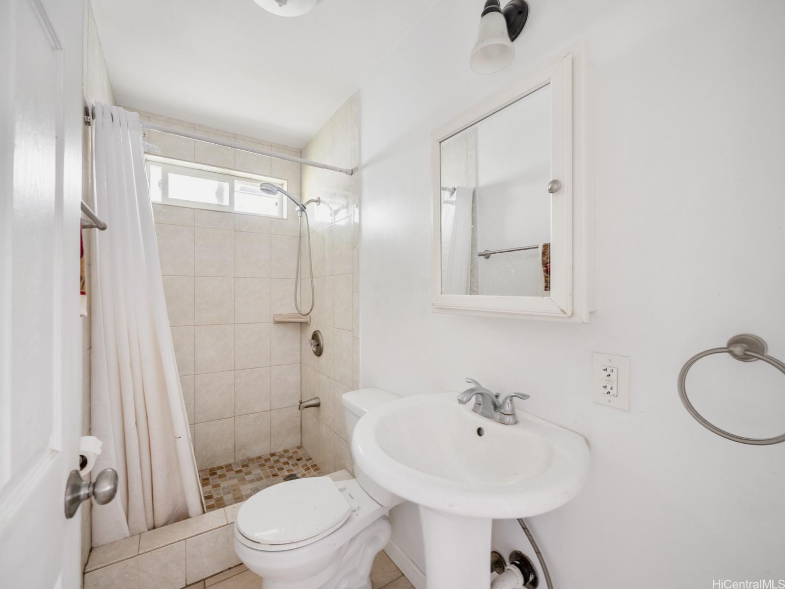 45-510 Pahia Road Kaneohe, HI 96744 - Photo 18 of 24 a bathroom with a sink toilet and shower