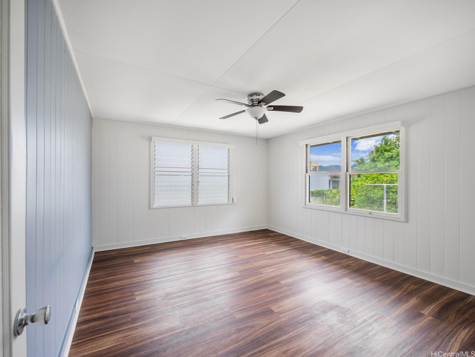 45-510 Pahia Road Kaneohe, HI 96744 - Photo 6 of 24 a view of an empty room with wooden floor and a window