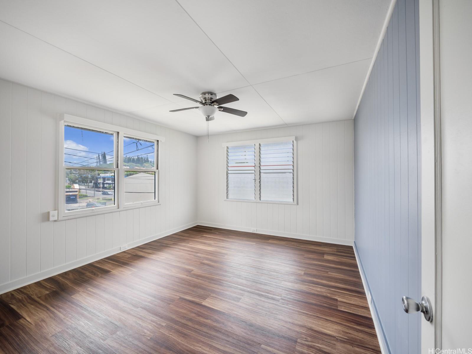 45-510 Pahia Road Kaneohe, HI 96744 - Photo 8 of 24 a view of an empty room with wooden floor and a window