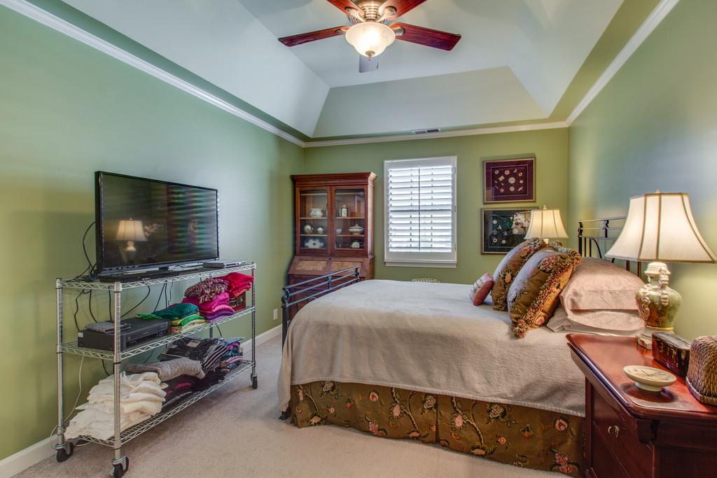 600 General George Patton Road Nashville, TN 37221 - Photo 14 of 18 a bedroom with a bed and a flat screen tv