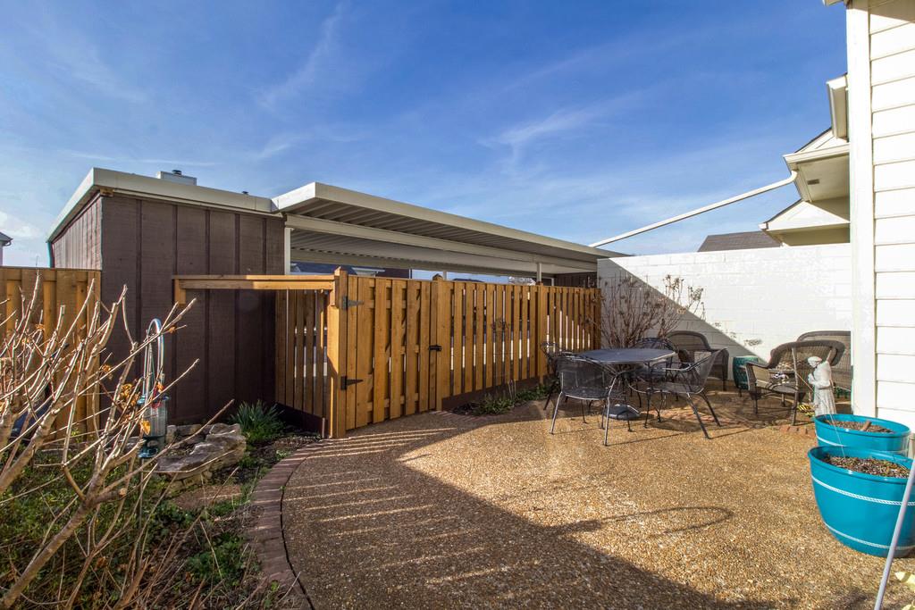 600 General George Patton Road Nashville, TN 37221 - Photo 16 of 18 a backyard of a house with table and chairs