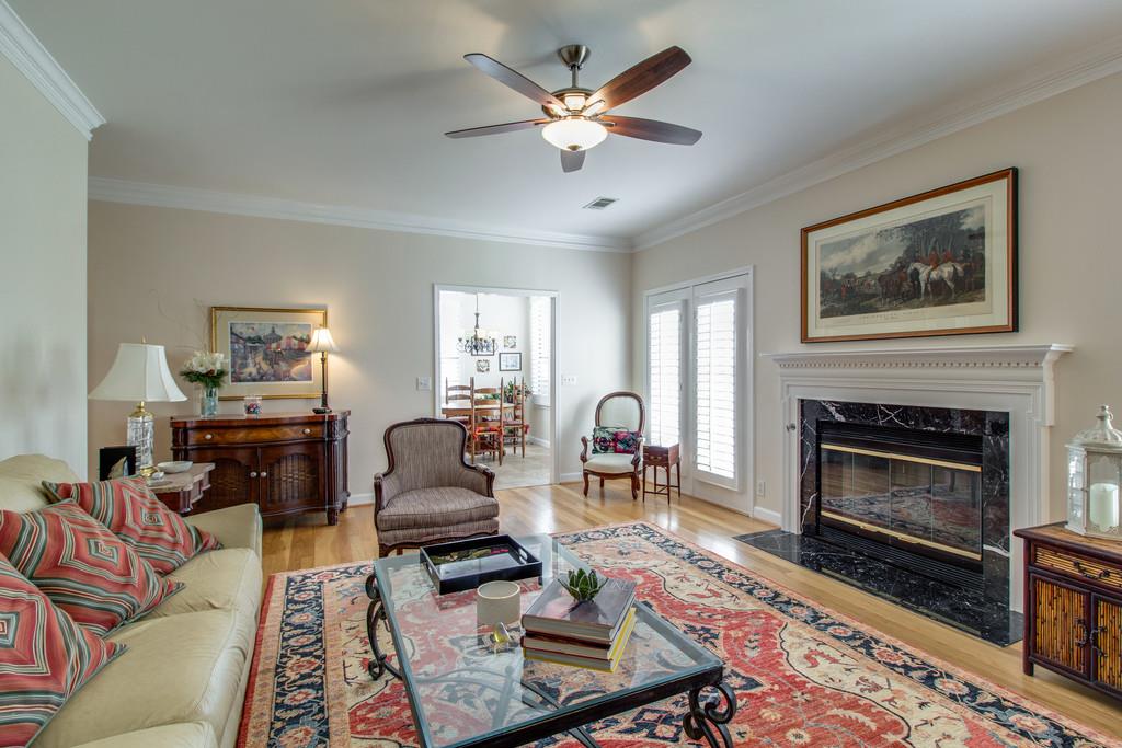 600 General George Patton Road Nashville, TN 37221 - Photo 4 of 18 a living room with furniture a fireplace and a flat screen tv