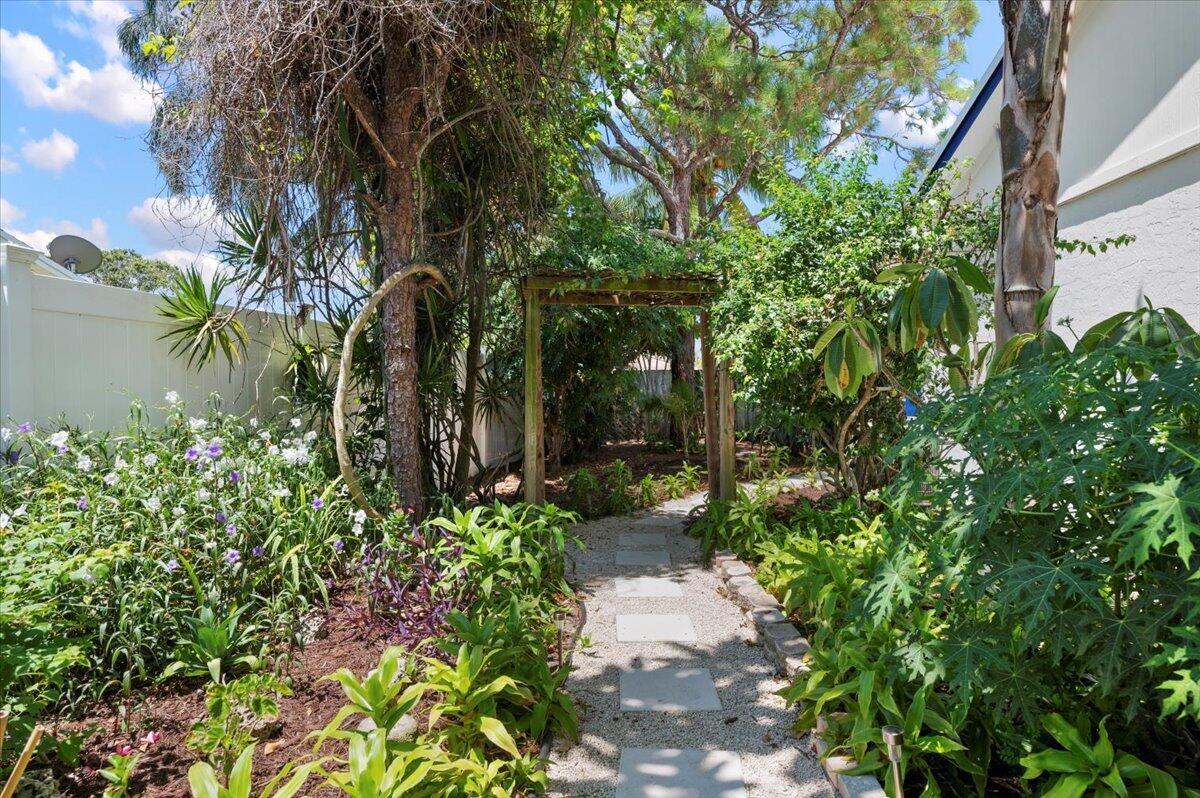 196 Raintree Trail Jupiter, FL 33458 - Photo 25 of 39 Side Yard Paths to Backyard