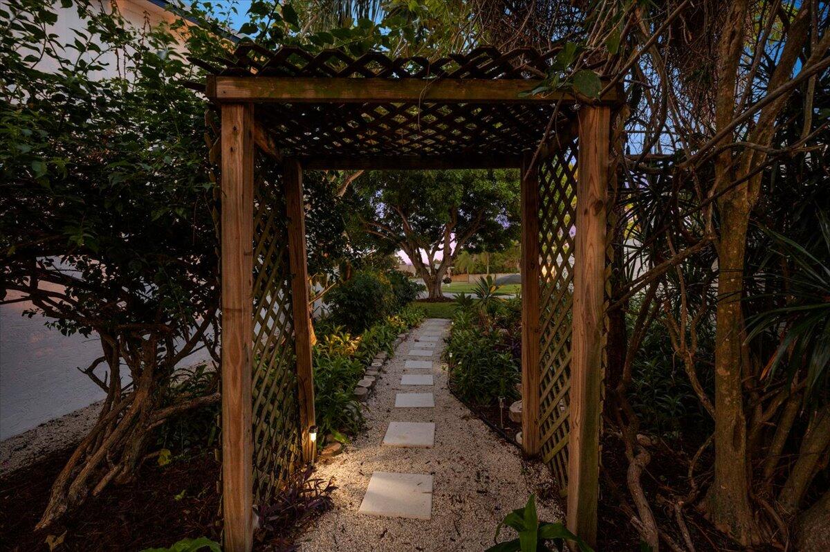 196 Raintree Trail Jupiter, FL 33458 - Photo 26 of 39 Side Yard Paths to Backyard