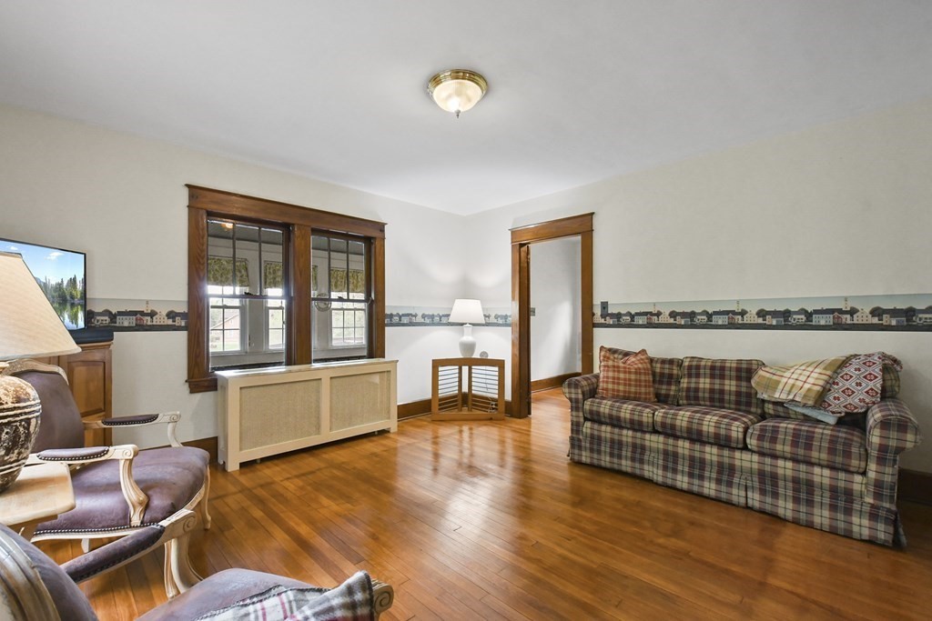 55 New Athol Road Orange, MA 01364 - Photo 4 of 33 a living room with furniture fireplace and wooden floor