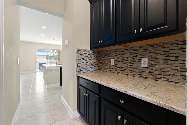 a bathroom with a granite countertop sink a toilet and a bathtub