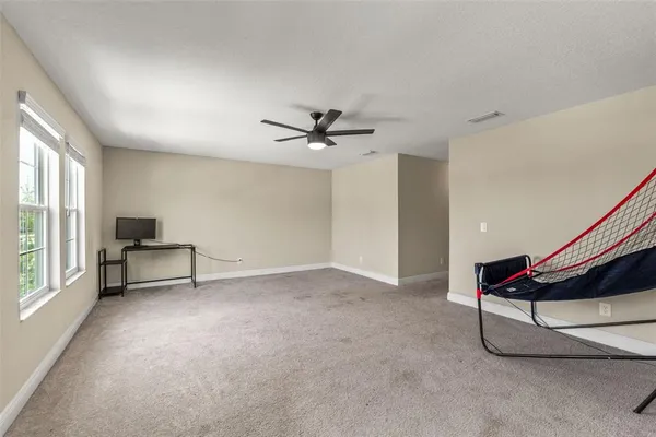 a bathroom with a granite countertop sink a vanity and a mirror