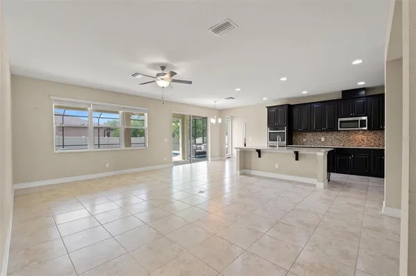 a view of a kitchen with a sink and cabinets