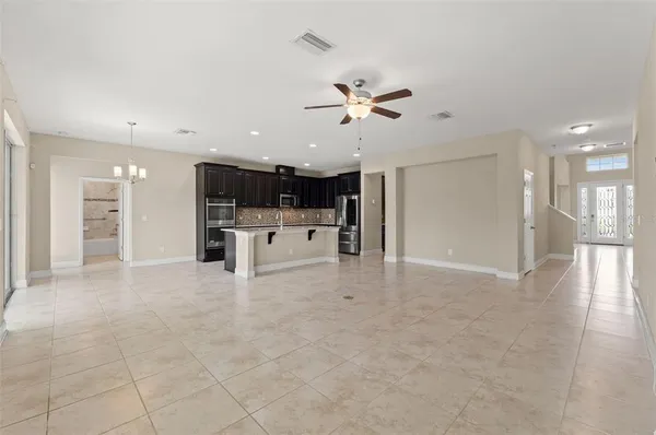 a kitchen with granite countertop a sink and cabinets