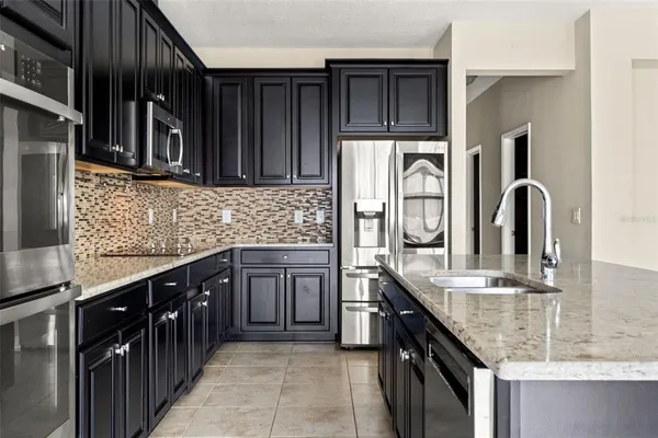 a view of a room with empty cabinets and a window