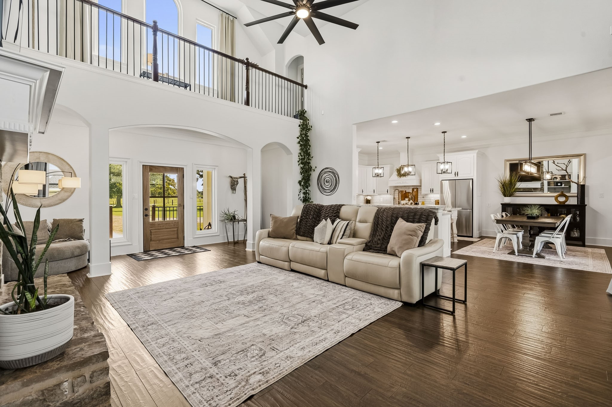 3103 Brundrett Road Wallis, TX 77485 - Photo 12 of 45 The Family Room flows effortlessly into the Kitchen and Breakfast Room, creating an inviting open-concept layout designed for both everyday living and seamless entertaining. Expansive sightlines connect each gathering space, allowing conversations to carry effortlessly throughout the heart of the home while enhancing the sense of openness, light, and togetherness.