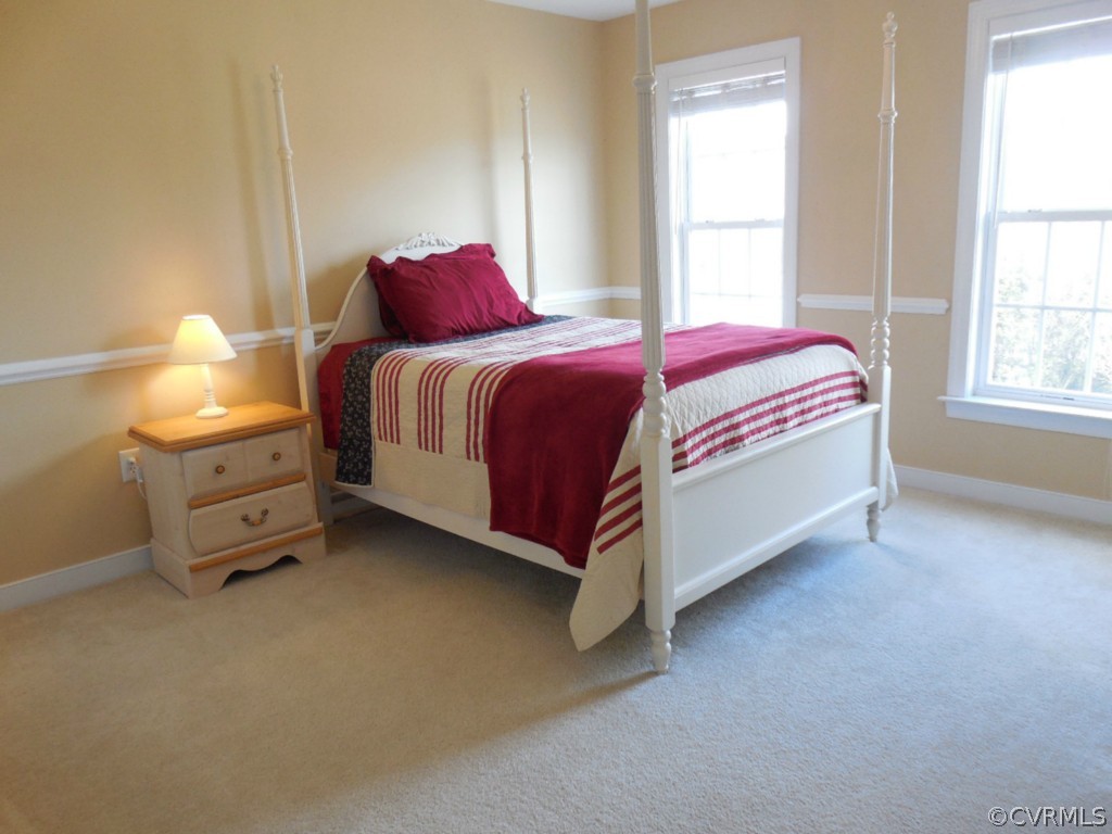 13213 Tipple Point Road Midlothian, VA 23114 - Photo 16 of 24 a bedroom with a bed and window