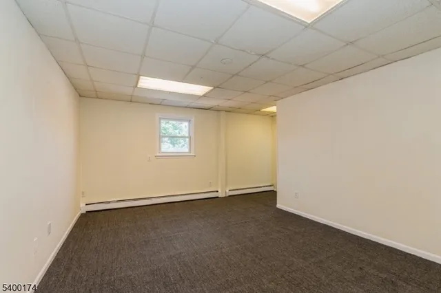 an empty room with a empty space and windows