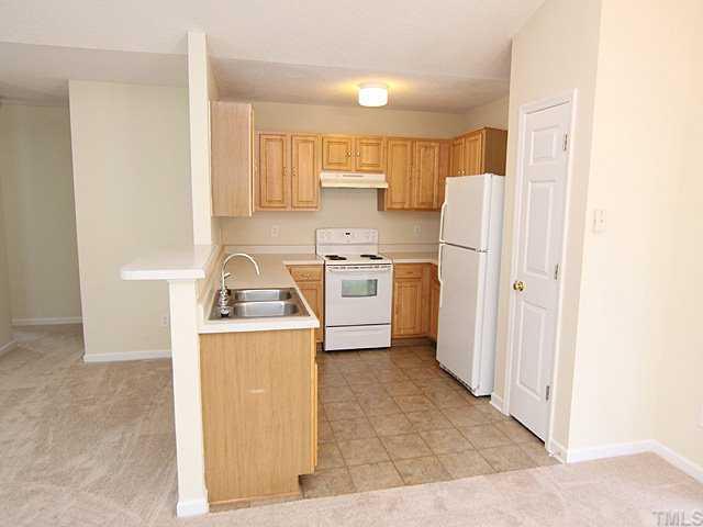 4817 Silverdene Street Raleigh, NC 27616 - Photo 12 of 12 Great Floor Plan for entertaining. Breakfast bar, double stainless sinks, lots of counter space and a pantry.