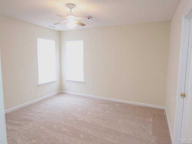 4817 Silverdene Street Raleigh, NC 27616 - Photo 5 of 12 Master bedroom with new carpet, walk-in closet and ceiling fan with light.