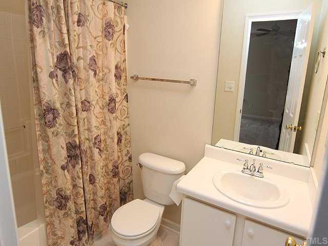 4817 Silverdene Street Raleigh, NC 27616 - Photo 6 of 12 Master bath has a large garden tub and new vinyl flooring.