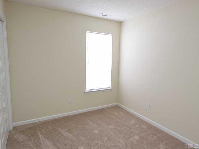 4817 Silverdene Street Raleigh, NC 27616 - Photo 7 of 12 Guest Bedroom with new carpet