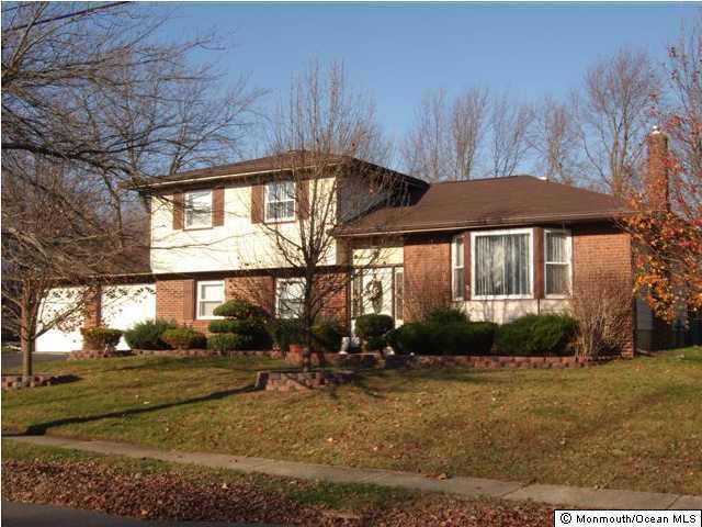 14 Westbrook Road Howell, NJ 07731 - Photo 1 of 3 a front view of a house with garden
