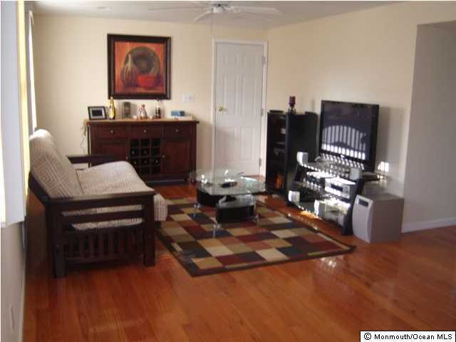 14 Westbrook Road Howell, NJ 07731 - Photo 2 of 3 a living room with furniture and a fireplace