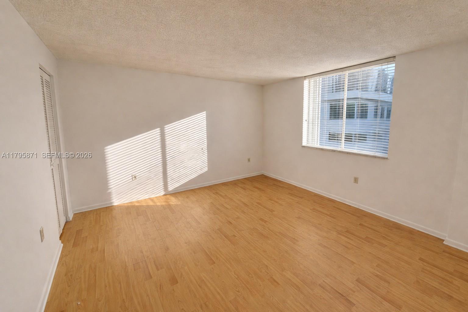126 Southwest 17th Road, Unit 505 Miami, FL 33129 - Photo 2 of 27 a view of empty room with windows