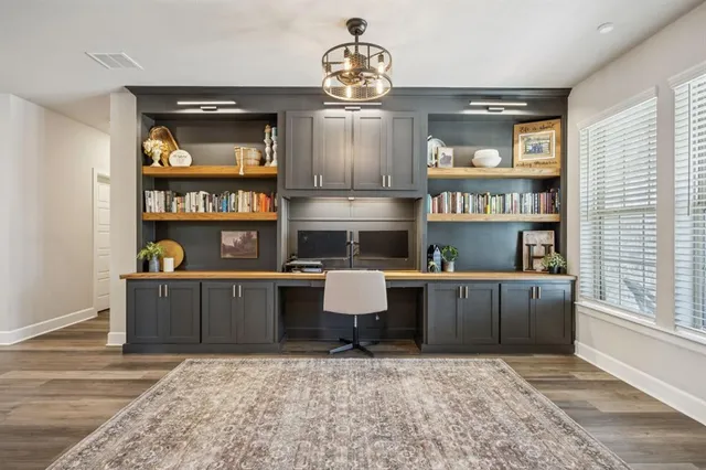 a kitchen with stainless steel appliances granite countertop a stove and cabinets