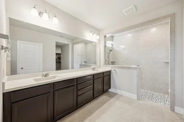 a bathroom with a double vanity sink mirror and double