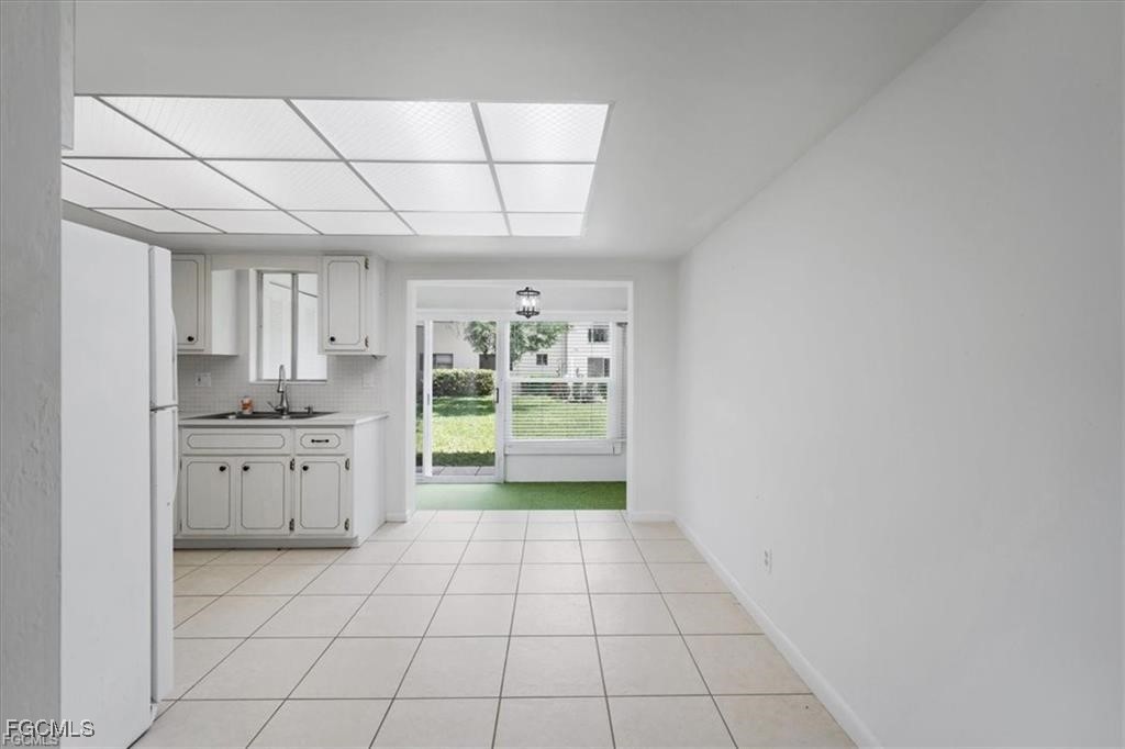 339 Joel Boulevard, Unit 121 Lehigh Acres, FL 33936 - Photo 18 of 40 a bathroom with a sink a vanity and a mirror