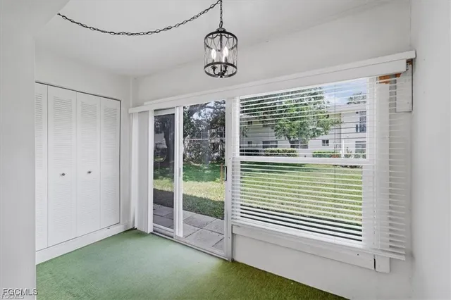 a view of an empty room with windows