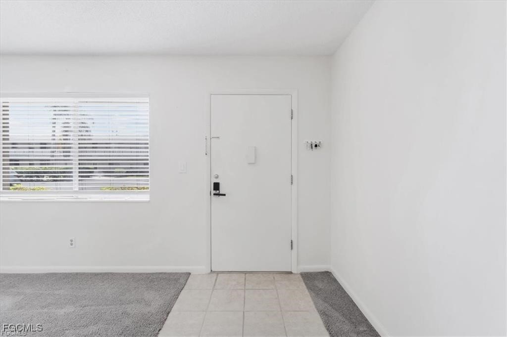 339 Joel Boulevard, Unit 121 Lehigh Acres, FL 33936 - Photo 3 of 40 a view of an empty room