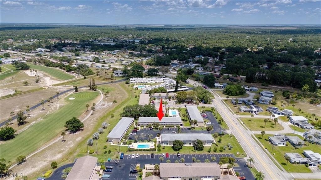 339 Joel Boulevard, Unit 121 Lehigh Acres, FL 33936 - Photo 39 of 40 an aerial view of residential houses with outdoor space