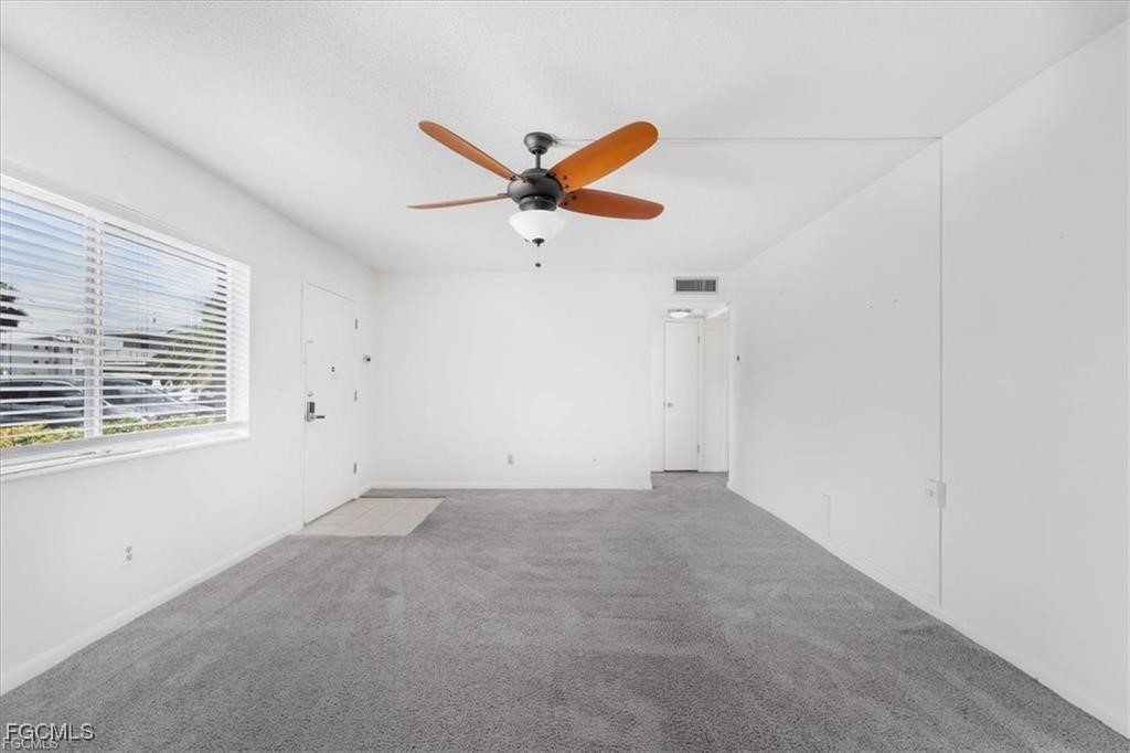 339 Joel Boulevard, Unit 121 Lehigh Acres, FL 33936 - Photo 5 of 40 an empty room with a window and a fan