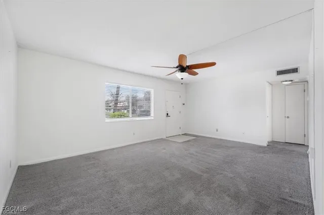 a view of an empty room with a window