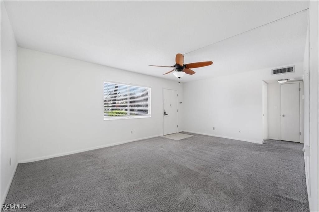 339 Joel Boulevard, Unit 121 Lehigh Acres, FL 33936 - Photo 6 of 40 a view of an empty room with a window
